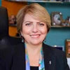 Woman in a professional setting with a blurred background
